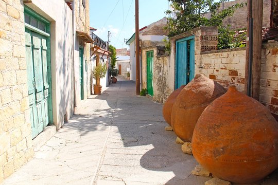 A narrow cozy street in Omodos town on a beautiful sunny day, Cyprus.