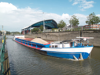 Barge on a canal transporting sand. The canal is a waterway connection between Brussels and Charleroi.