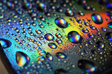 Colored rainbow water droplets on the disc