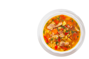 soup with meat, rice and vegetable. top view. isolated on white