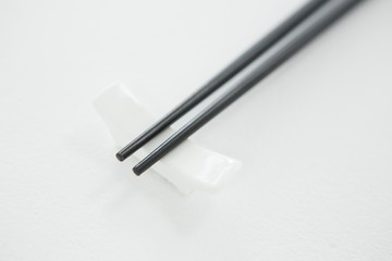 Black chopsticks on a chopstick rest