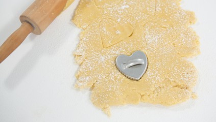 Rolling pin and cookie cutter on dough