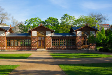 Fototapeta premium Pavilion in Grebovka / Grobovka, Havlicek Gardens, Prague, Czech Republic / Czechia - small building in the park. Green trees and grass around. Vibrant colors during spring / summer