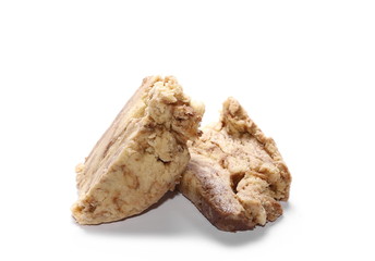 Sweet halva with cocoa on a white background