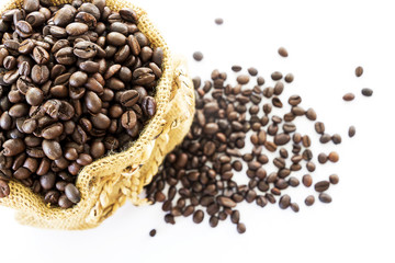 Coffee beans in a sack on a white background.
