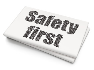 Protection concept: Safety First on Blank Newspaper background