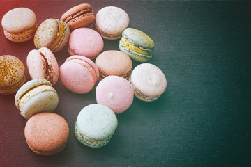 Macarons cake, top view flat lay, pattern macaroon, black background