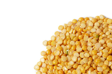 Dry yellow split peas isolated on white.