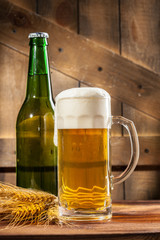 Glass of beer and beer bottle