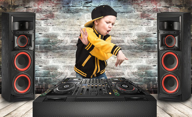The little boy in the style of Hip-Hop .Cool rap dj. Children's fashion.Cap and jacket. The Young Rapper.
