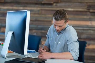 Attentive businessman working at desk