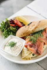 healthy fresh smoked salmon sandwich with egg and sour cream
