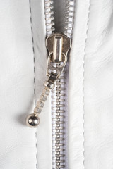 White leather jacket zipper. Macro leather jacket zipper and details