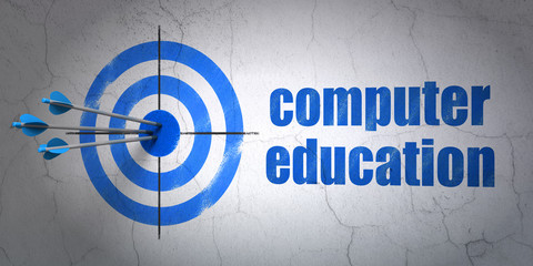Learning concept: target and Computer Education on wall background