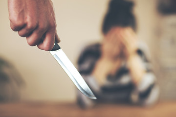 man hand knife want to injure his wife