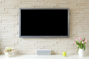 Blank modern flat screen TV at the white brick wall with copy space - 150242070