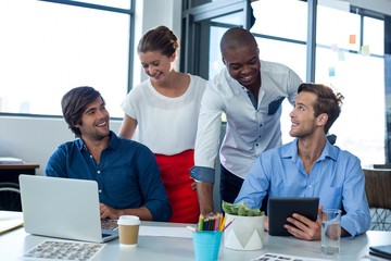 Team of graphic designers interacting with each other