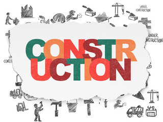 Building construction concept: Construction on Torn Paper background