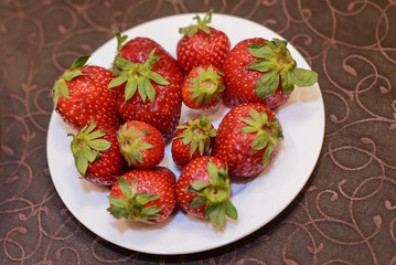Strawberry in a plate on the table