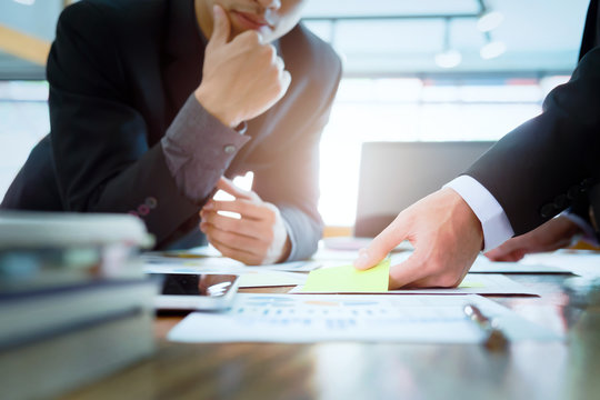 Businessmen teamwork brainstorming meeting to discuss plan startup project
