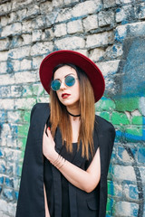 Fashion pretty woman model wearing a red hat