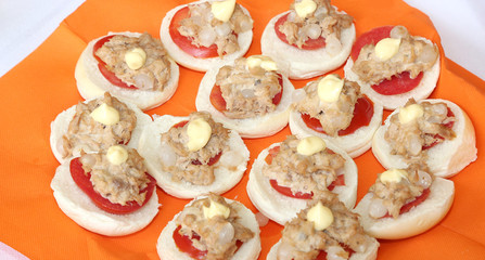 Tasty sandwiches with tuna and onions on the table of restaurant