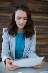 Female graphic designer looking at photos