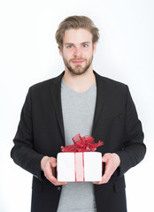 handsome bearded happy man with present box in red ribbon