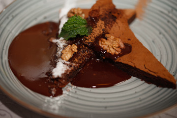 Brownie cake with walnut and chocolate on the plate