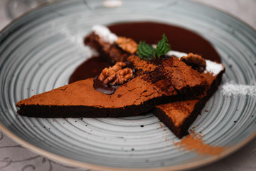 Brownie cake with walnut and chocolate on the plate