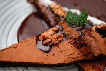 Brownie cake with walnut and chocolate on the plate