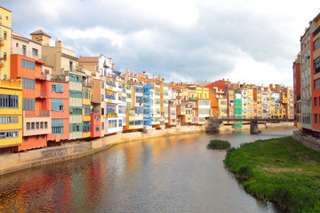 Fototapeta na wymiar Typical colorful painted houses overlooking the river Onyar, Girona, Spain