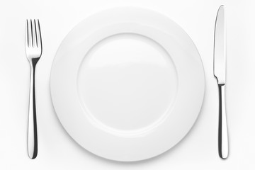 Empty plate, fork, knife, clipping path,
white background, isolated, top view from first person