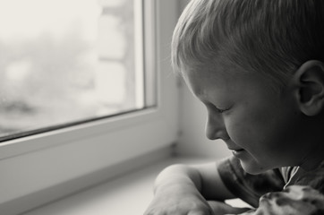 Missing child. Abandoned toy. Loneliness. Black and white image.