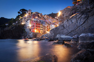 picturesque town of Riomaggiore at night in Cinque Terre National park, Liguria region, Italy © Melinda Nagy