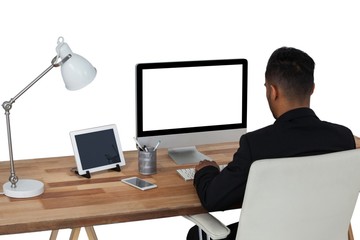Businessman working over computer