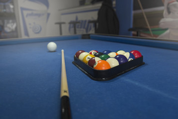 Billiard balls on blue table with billiard cues, Snooker, Pool game.