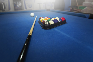 Billiard balls on blue table with billiard cues, Snooker, Pool game.