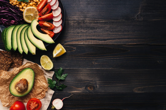 Healthy Vegan Food Concept. Healthy Food With Vegetables And Whole Wheat Bread On The Wooden Table Top View. Copy Space