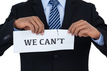  image of businessman tearing a paper