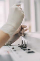 Female researcher doing research in a chemistry lab. Gas chromatograph