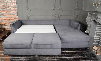 Gray sofa in a dark room