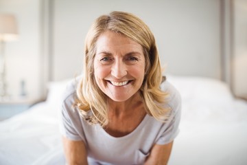 Fototapeta premium Portrait of smiling woman in bedroom