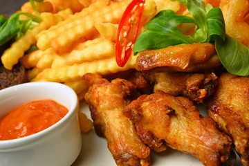 BBQ chicken wings with fry potato chilli paper and sauce