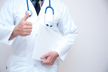 close up of male doctor hand showing thumbs up.