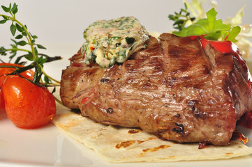 Grilled steak meat with salad and tomato