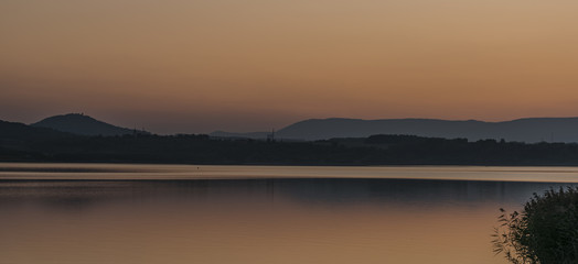 Sunset near Milada lake in north Bohemia