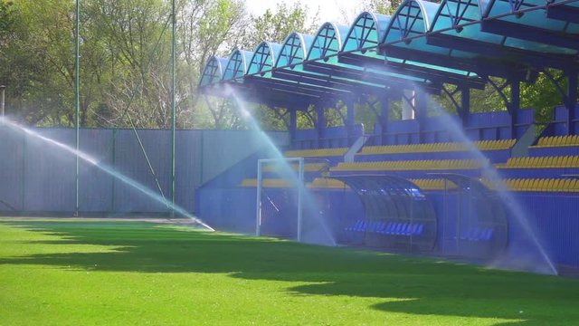 Football field watering, slow motion