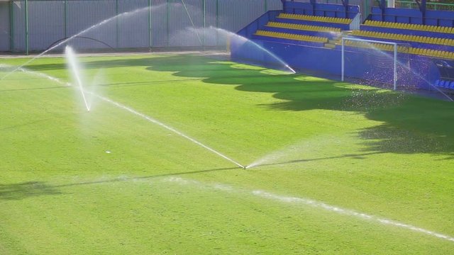 Football field watering, slow motion