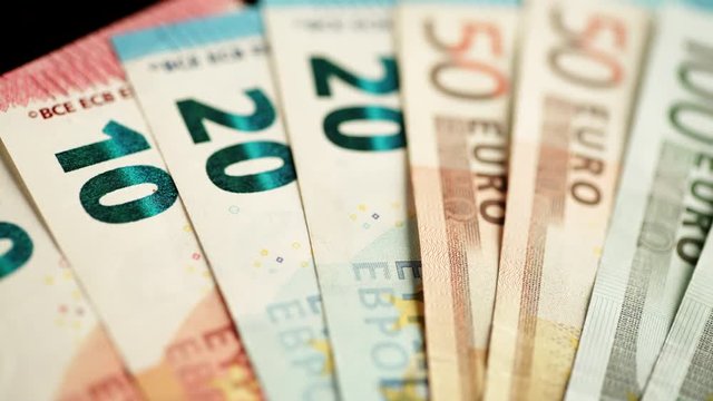 Nobody. Euro banknotes of different values. Euro cash money background. Dolly sliding shot 4K ProRes HQ codec